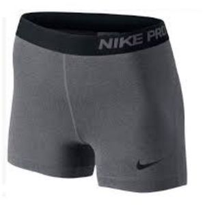 Grey and black Nike pros